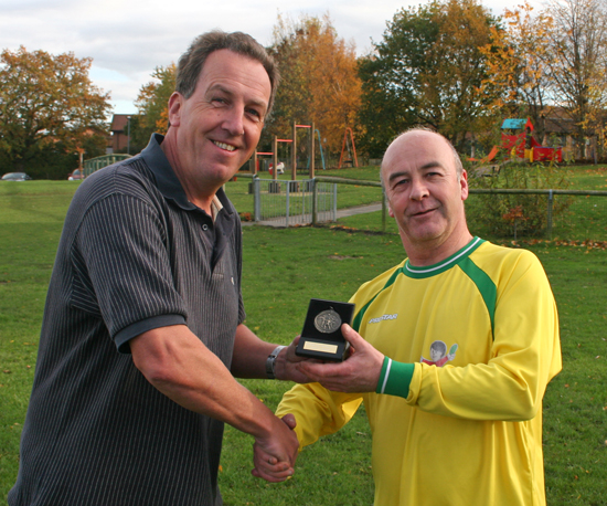 Pete Dessington receives season medal from club sponsor Eifion Jones